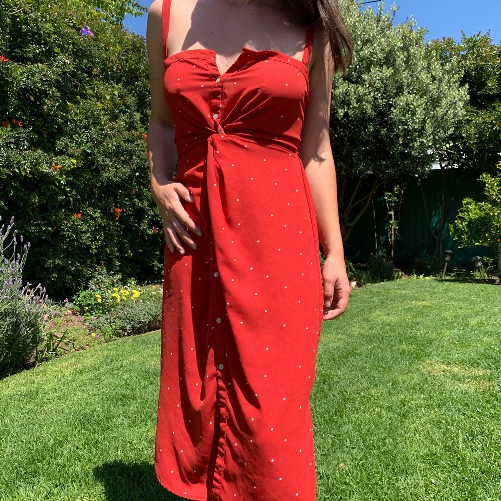 Red polka dot dress with front twist